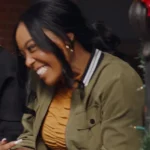 Dominque Perry Unexpected Christmas 2025 green bomber jacket