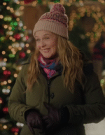 Alicia Silverstone A Merry Little Ex-Mas 2025 green hooded parachute puffer jacket