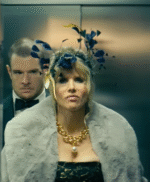 Lucy Punch Jingle Bell Heist 2025 gray faux fur jacket