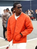 Joshua Pearce F1 The Movie orange jacket