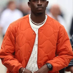 Damson Idris F1 The Movie 2025 orange jacket